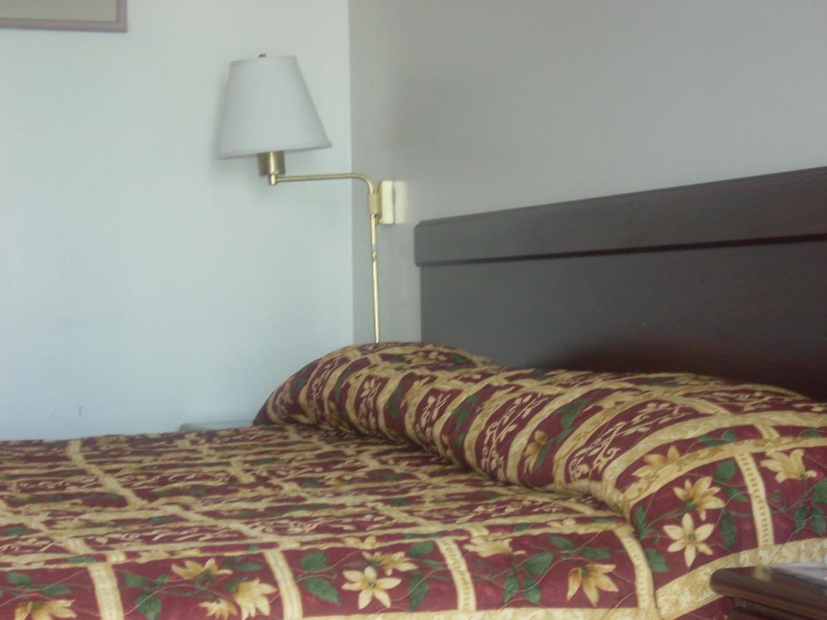 Economy Inn Сийсайд Екстериор снимка